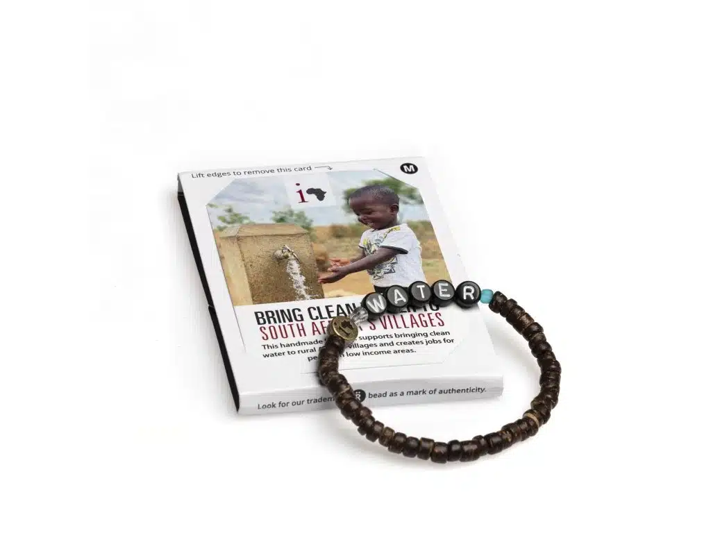 Book cover promoting clean water initiative in South African villages, featuring a young boy at a tap and handmade beaded bracelet.